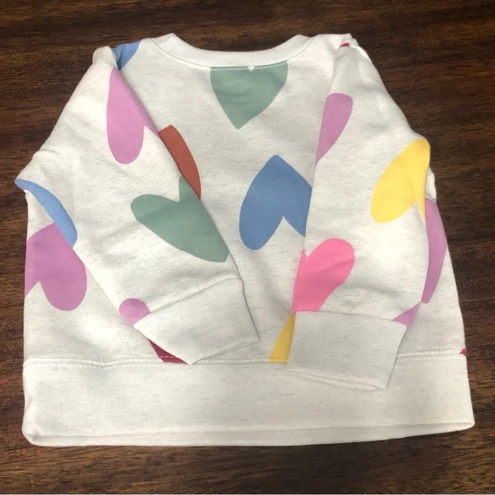 Baby girl’s sweatshirt heart graphic All over crewneck pull over beige.6-9 M